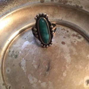 Silver ring with green stone